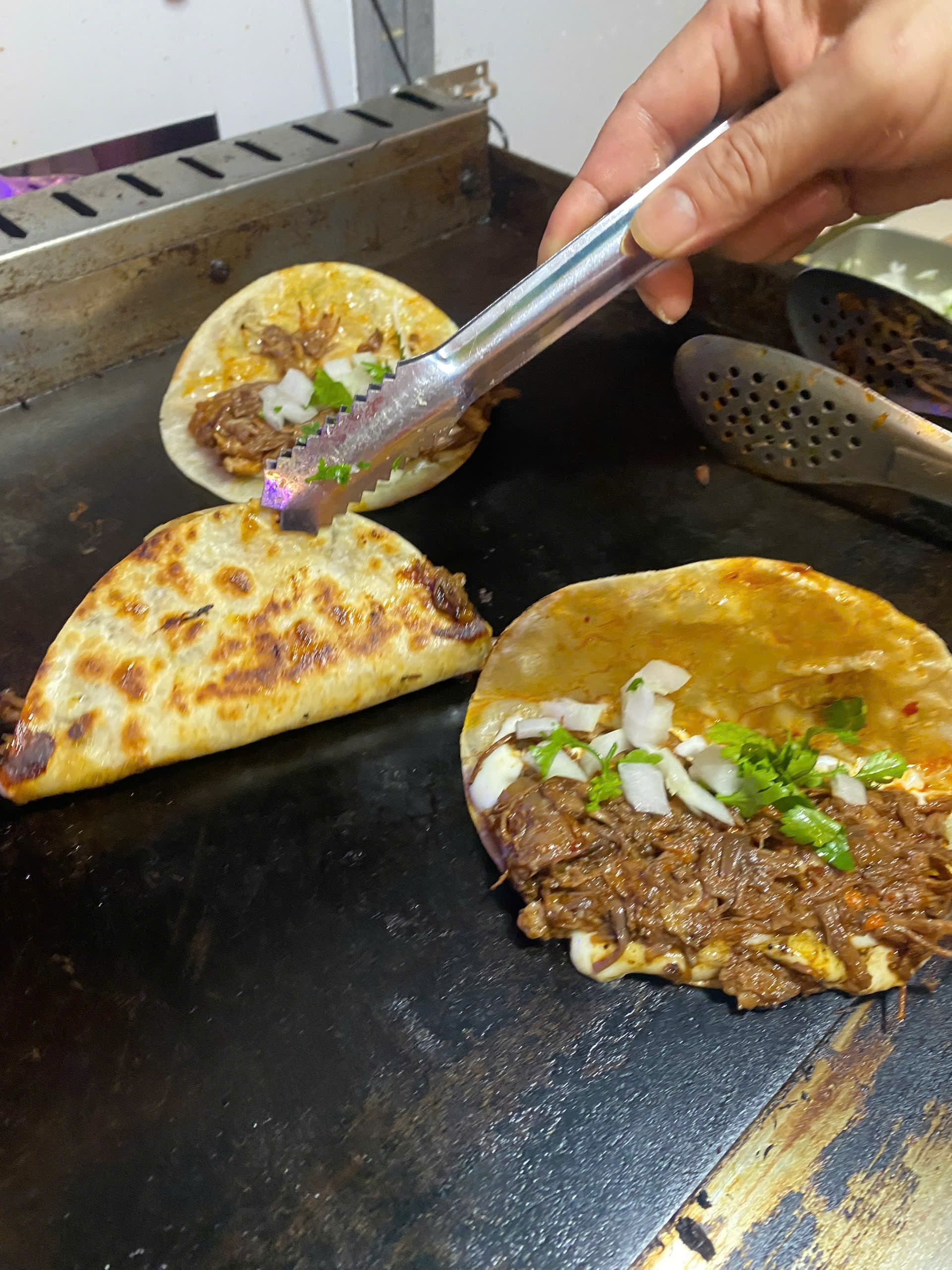 Owner serving tacos